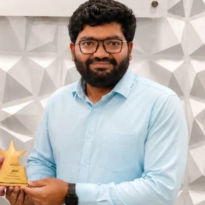 Dattaprasad Ekavade holding a Pixel Employee of the Month award